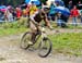 a very muddy Gee Atherton (Great Britain) 		CREDITS:  		TITLE: MTB World Championships 2011 		COPYRIGHT: Rob Jones/www.canadiancyclist.com 2011© All rights retained - no copying, printing or other manipulation, editing or processing permitted without prio