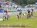 Nash goes up on her front wheel after the first half log obstacle 		CREDITS:  		TITLE: Nove Mesto Na Morave World Cup 		COPYRIGHT: Rob Jones/www.canadiancyclist.com 2011© All rights retained - no copying, printing or other manipulation, editing or process