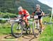 Nathalie Schneitter (Colnago Farbe Sudtirol) and Emily Batty (Subaru - Trek) 		CREDITS:  		TITLE: World Cup Val di Sole 2011 		COPYRIGHT: Rob Jones/www.canadiancyclist.com 2011© All rights retained - no copying, printing or other manipulation, editing or 