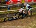 Sandra Walter goes down in front of Natasha Elliott 		CREDITS:  		TITLE: 2012 Cyclocross Nationals 		COPYRIGHT: Rob Jones/www.canadiancyclist.com 2012- copyright- All rights retained - no use permitted without prior, written permission