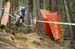 Joe Smith blasting out over a root choked rut in hopes of getting a few hundredths of a second more.  		CREDITS:  		TITLE: UCI 2012 MTB World Championships 		COPYRIGHT: ¬© Colin Meagher