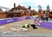 Workers install the Olympic rings on the first corner, but it didn