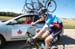 taking a feed from the Team Canada car 		CREDITS:  		TITLE: Tour of Alberta, 2013 		COPYRIGHT: © CanadianCyclist.com 2013