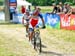 Julien Absalon (Bmc Mountainbike Racing Team) & Nino Schurter (Scott Swisspower MTB Racing Team) through the feedzone for the last time 		CREDITS:  		TITLE: Val di Sole World Cup 		COPYRIGHT: Rob Jones/www.canadiancyclist.com 2013 -copyright -All rights r