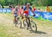 Julien Absalon (Bmc Mountainbike Racing Team) & Nino Schurter (Scott Swisspower MTB Racing Team) through the feedzone for the last time 		CREDITS:  		TITLE: Val di Sole World Cup 		COPYRIGHT: Rob Jones/www.canadiancyclist.com 2013 -copyright -All rights r