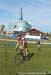 Through the grass with the Human Rights Museum in the background 		CREDITS:  		TITLE: 2014 Cyclo-cross Nationals 		COPYRIGHT: Rob Jones/www.canadiancyclist.com 2014 -copyright -All rights retained - no use permitted without prior, written permission