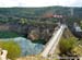 Crossing a huge hydro dam before the 2nd climb 		CREDITS:  		TITLE: 2014 Road World Championships Ponferrada Spain 		COPYRIGHT: Rob Jones/www.canadiancyclist.com 2014 -copyright -All rights retained - no use permitted without prior, written permission