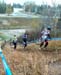 Provincial CX champion Shantel Koenig (Redbike) leading a trio up the slick run-up in the Open Womens race on Saturday. 		CREDITS:  		TITLE:  		COPYRIGHT: