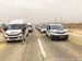 Giro vehicles stopped in the middle of the desert by one very zealous police officer - no one can pass 		CREDITS:  		TITLE: Giro d Italia 2018 		COPYRIGHT: Rob Jones/www.canadiancyclist.com 2018 -copyright -All rights retained - no use permitted without p