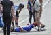 Duchesne on the ground after crashing into a spectator who wandered out onto the road 		CREDITS:  		TITLE: Canadian Road National Championships - RR 		COPYRIGHT: Rob Jones/www.canadiancyclist.com 2018 -copyright -All rights retained - no use permitted wit