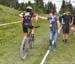 Catharine Pendrel feeds her Pendrel Racing rider Holden Jones 		CREDITS:  		TITLE: 2018 MTB XC Championships 		COPYRIGHT: Rob Jones/www.canadiancyclist.com 2018 -copyright -All rights retained - no use permitted without prior; written permission