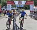 Team Nova Scotia does their final hand off 		CREDITS:  		TITLE: 2019 MTB XC National Championships 		COPYRIGHT: Rob Jones CanadianCyclist.com