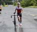 Determined to finish - even running in socks 		CREDITS:  		TITLE: Road National Championships, 2019 		COPYRIGHT: Rob Jones/www.canadiancyclist.com 2019 -copyright -All rights retained - no use permitted without prior, written permission