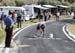 Fan decorating the road with a police officer watching 		CREDITS:  		TITLE: 2020 Road World Championships 		COPYRIGHT: Rob Jones/www.canadiancyclist.com 2020 -copyright -All rights retained - no use permitted without prior, written permission